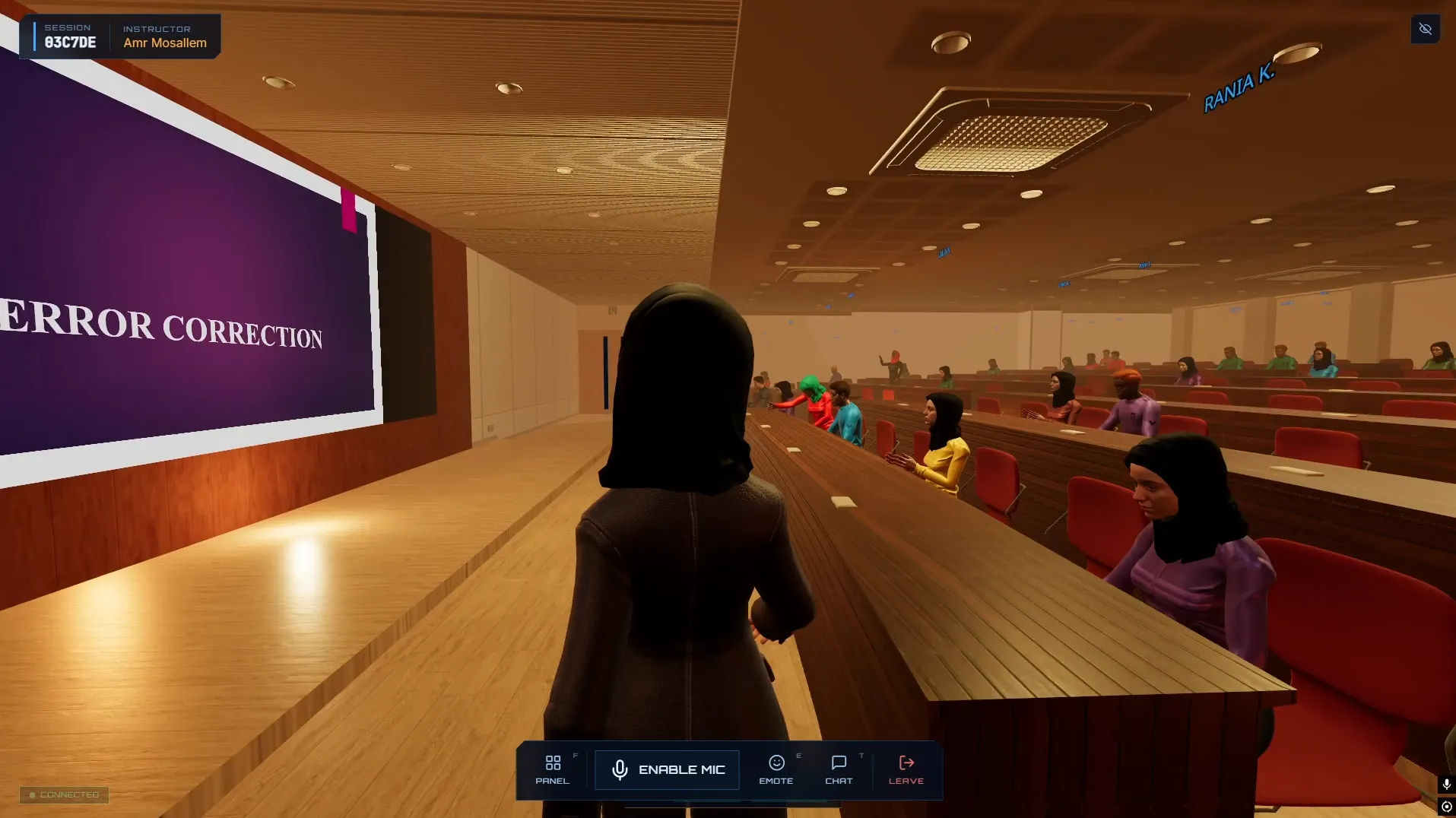 Instructor point of view on the hall floor during a live session, showing the session code